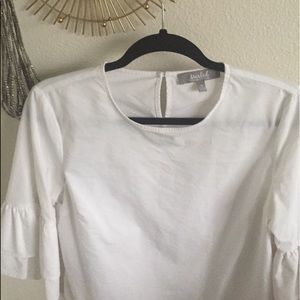 White linen ruffled shirt.